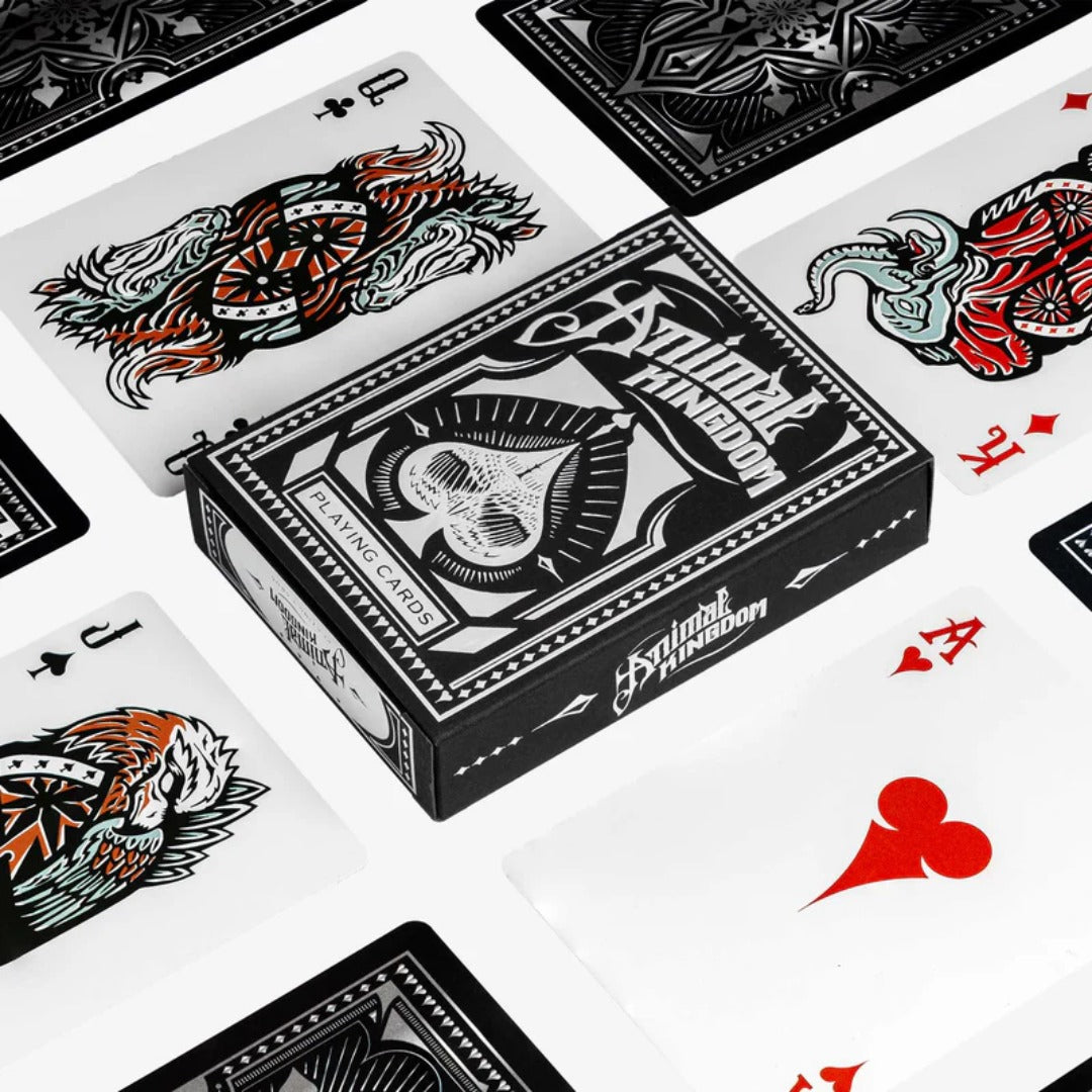 Playing cards with black and white designs on a white background