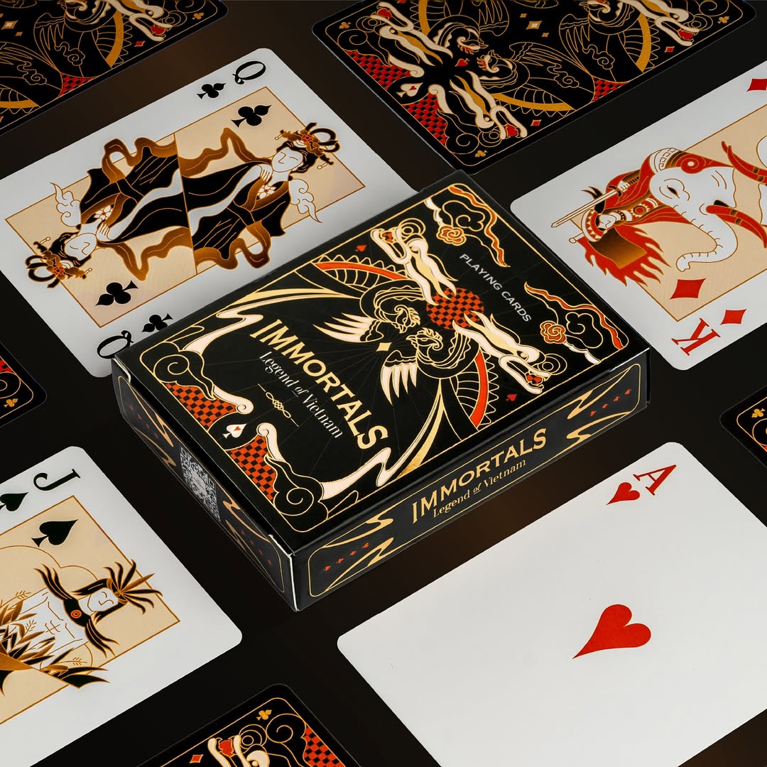 Playing cards with 'Immortals' packaging on a black background
