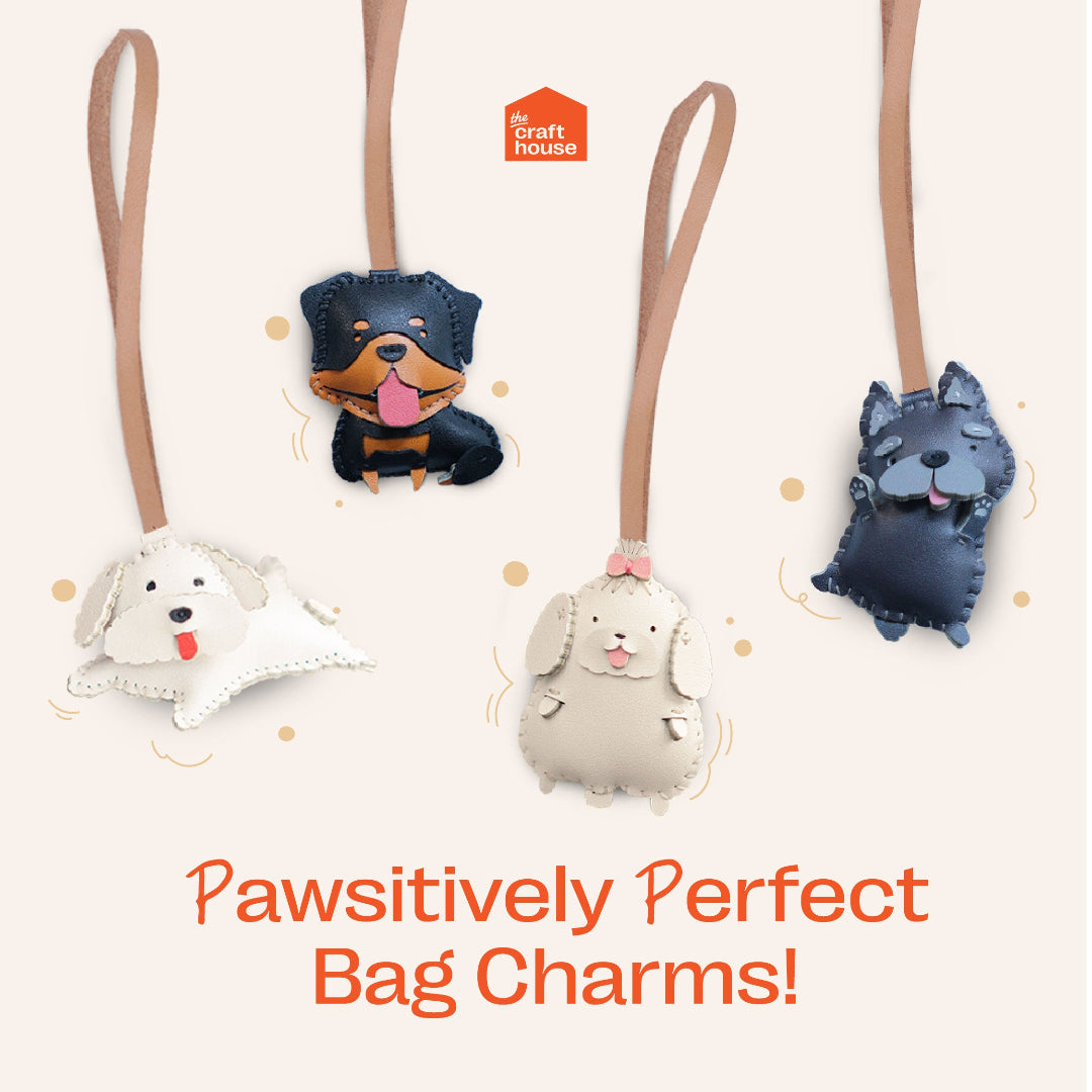 Four dog-shaped bag charms with brown straps on a light beige background, featuring the brand 'The Craft House'.