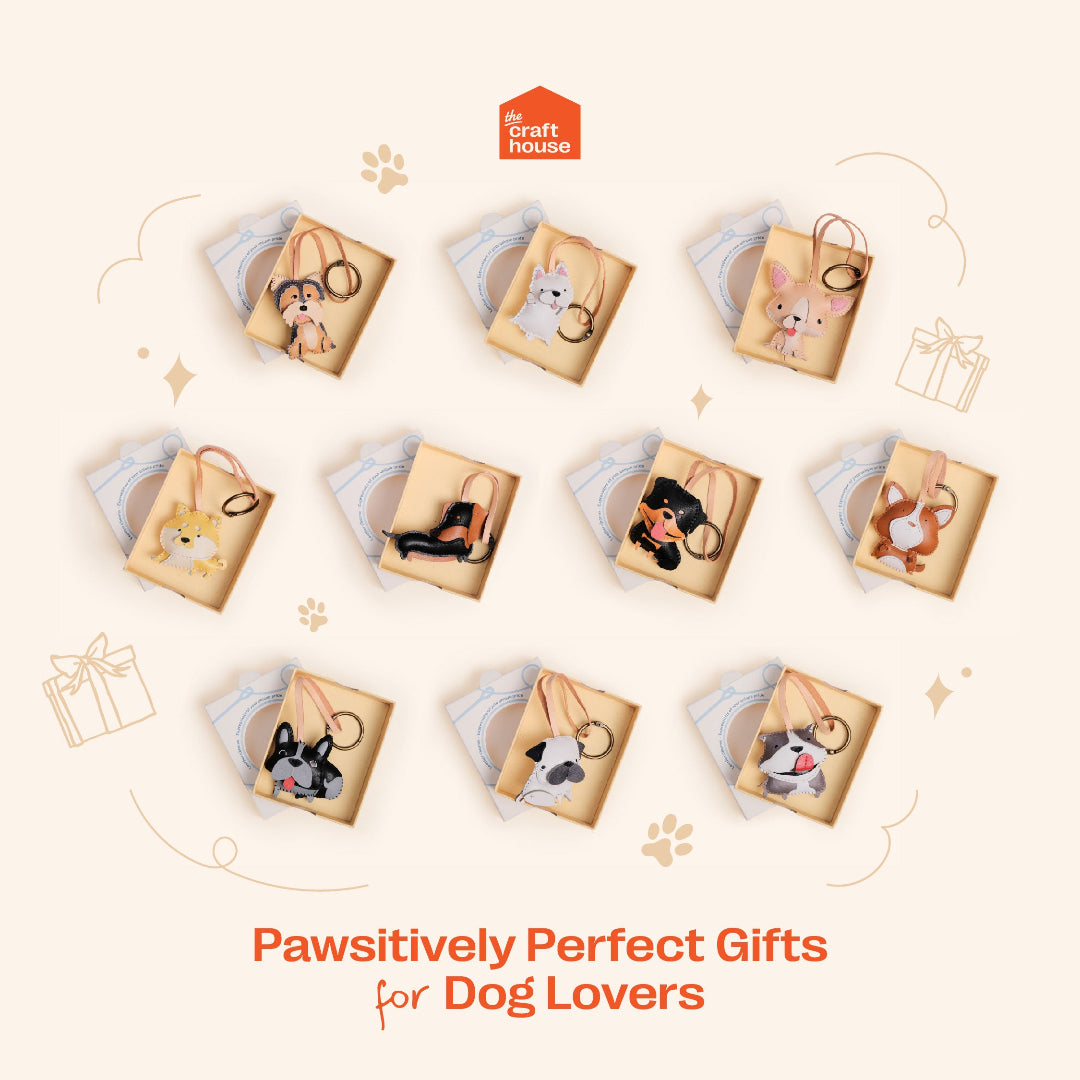 Gift boxes with dog illustrations and 'Pawsitively Perfect Gifts for Dog Lovers' text on a beige background.